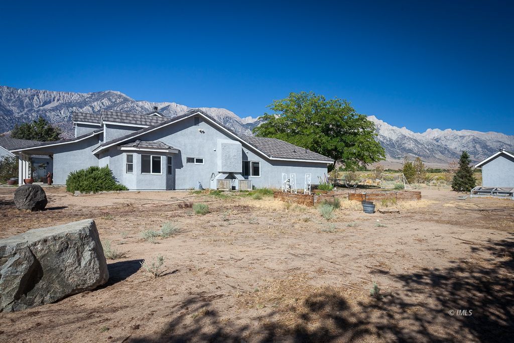 400 Dominy Road Lone Pine, CA 93545 - Photo 25 of 33 a front view of a house with a yard