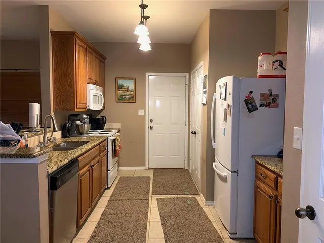 a bedroom with a bed and a sink