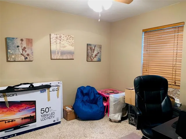 a bedroom with a bed and cabinets