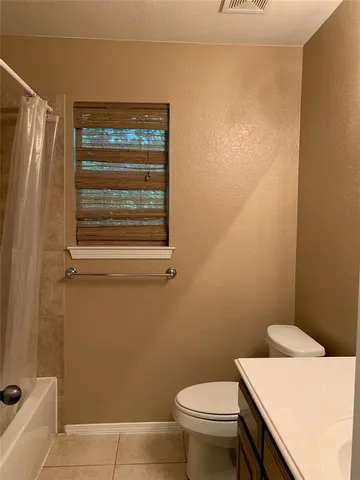 a view of backyard with tree