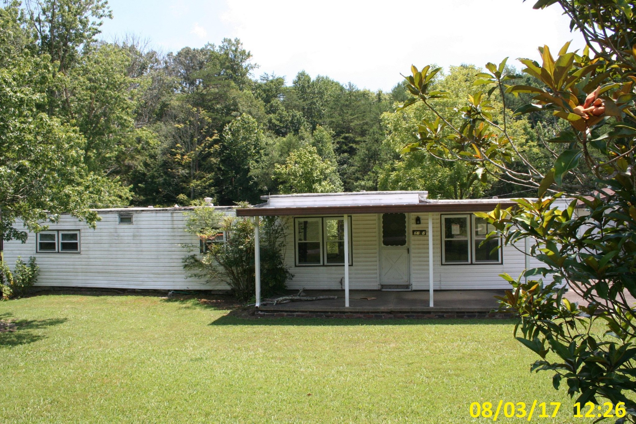 2757 West Wolf Valley Road Clinton, TN 37716 - Photo 1 of 10 a view of a house with pool and garden