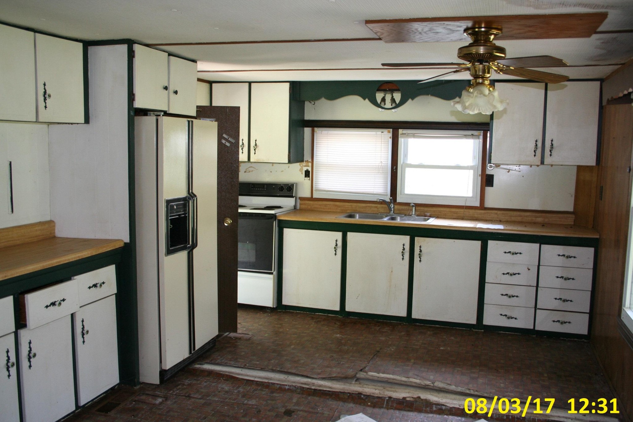 2757 West Wolf Valley Road Clinton, TN 37716 - Photo 2 of 10 a kitchen with stainless steel appliances a sink and a refrigerator