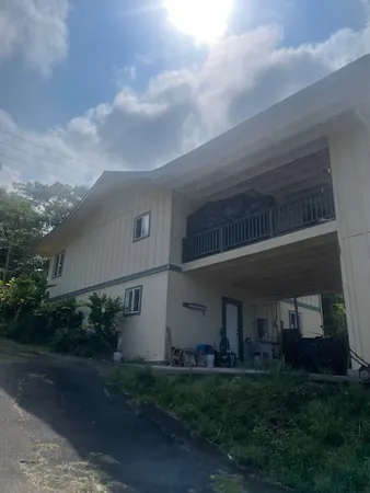a view of house with yard