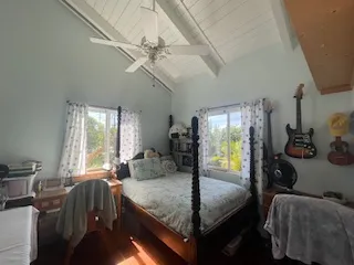 a bed room with furniture and a window