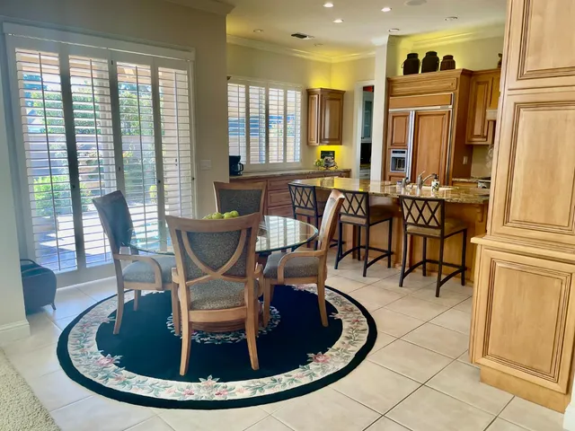 a view of a dining room with furniture window and outside view
