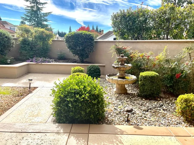a view of a backyard of the house