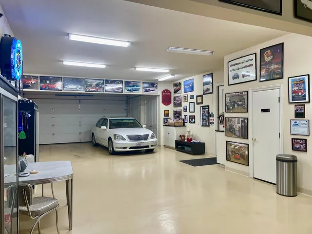 a utility room with lot of cabinet and a flat screen tv