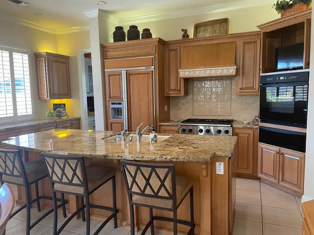 a kitchen with a counter space and appliances
