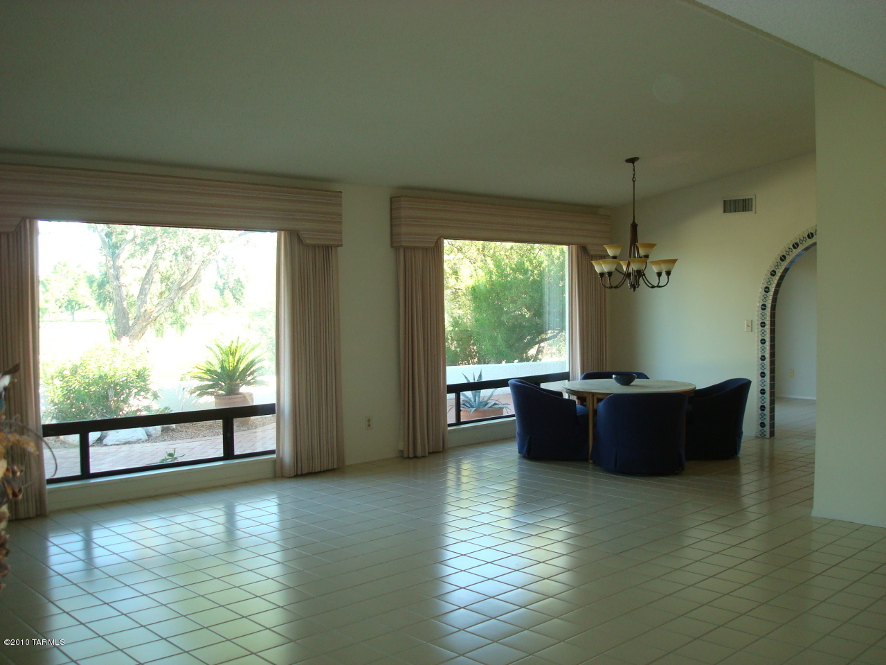 9985 North Desert Sky Road Oro Valley, AZ 85737 - Photo 10 of 43 a living room with furniture and a large window