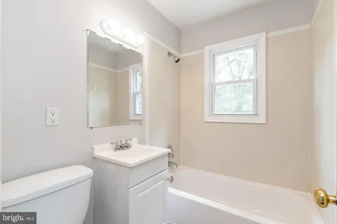 a bathroom with a sink toilet and bathtub