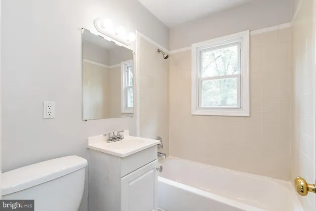 a bathroom with a sink toilet and bathtub