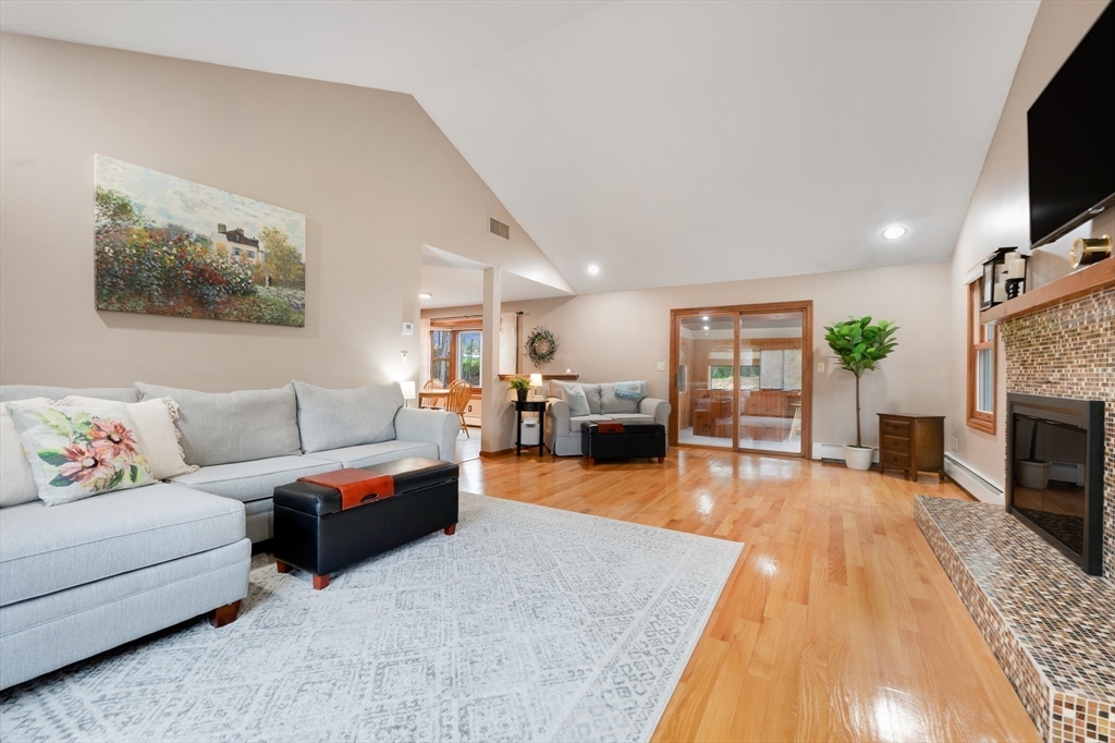 206 Olde Forge Road Hanover, MA 02339 - Photo 15 of 42 a living room with furniture and a flat screen tv
