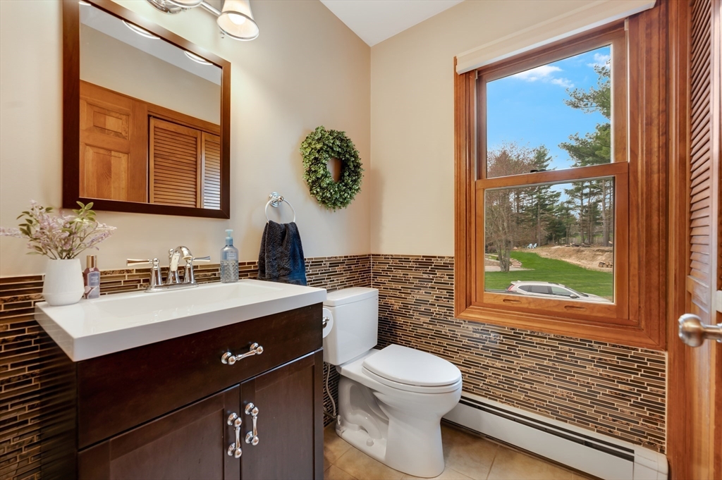 206 Olde Forge Road Hanover, MA 02339 - Photo 18 of 42 a bathroom with a sink vanity mirror and toilet