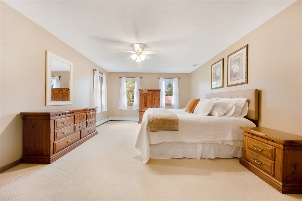 206 Olde Forge Road Hanover, MA 02339 - Photo 20 of 42 a spacious bedroom with a bed and a dresser