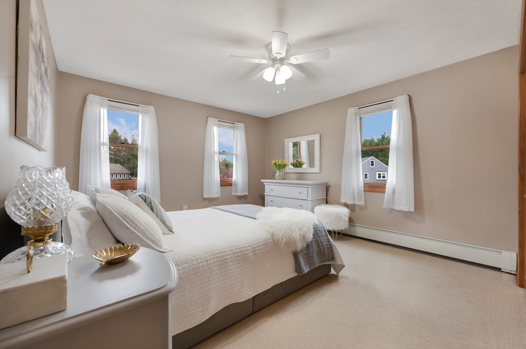 206 Olde Forge Road Hanover, MA 02339 - Photo 23 of 42 a bedroom with a bed mirror and window