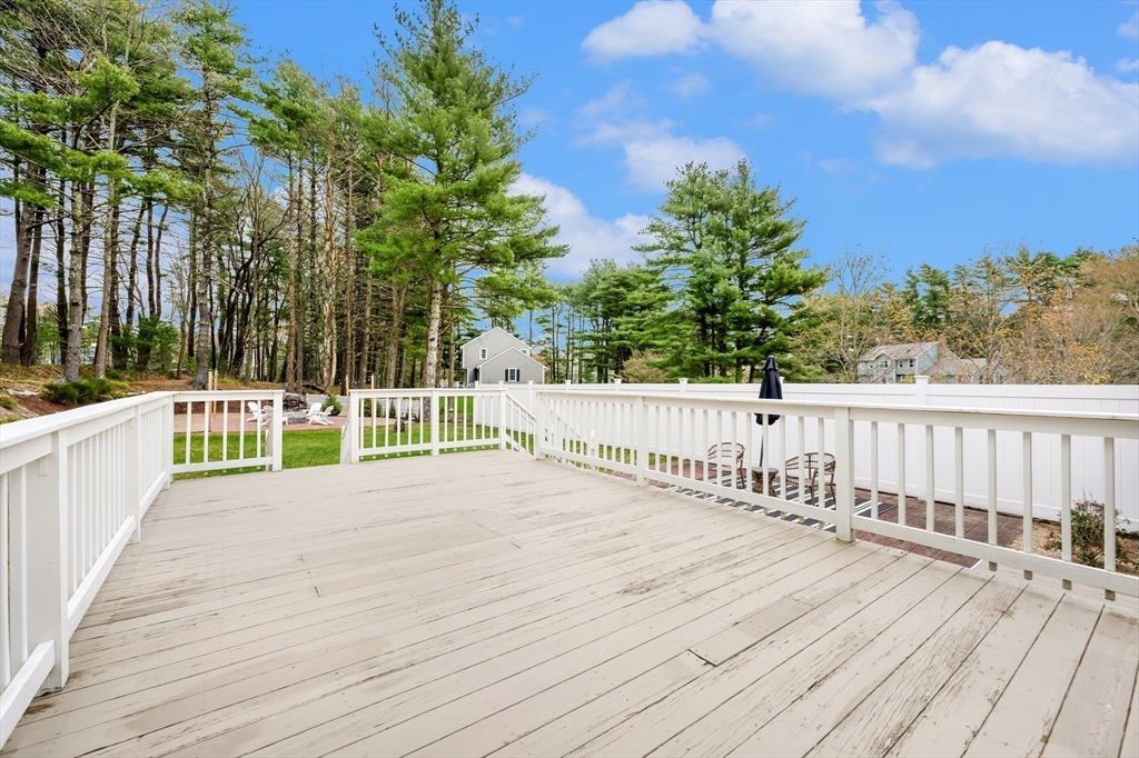206 Olde Forge Road Hanover, MA 02339 - Photo 32 of 42 a view of a balcony with wooden floor and fence