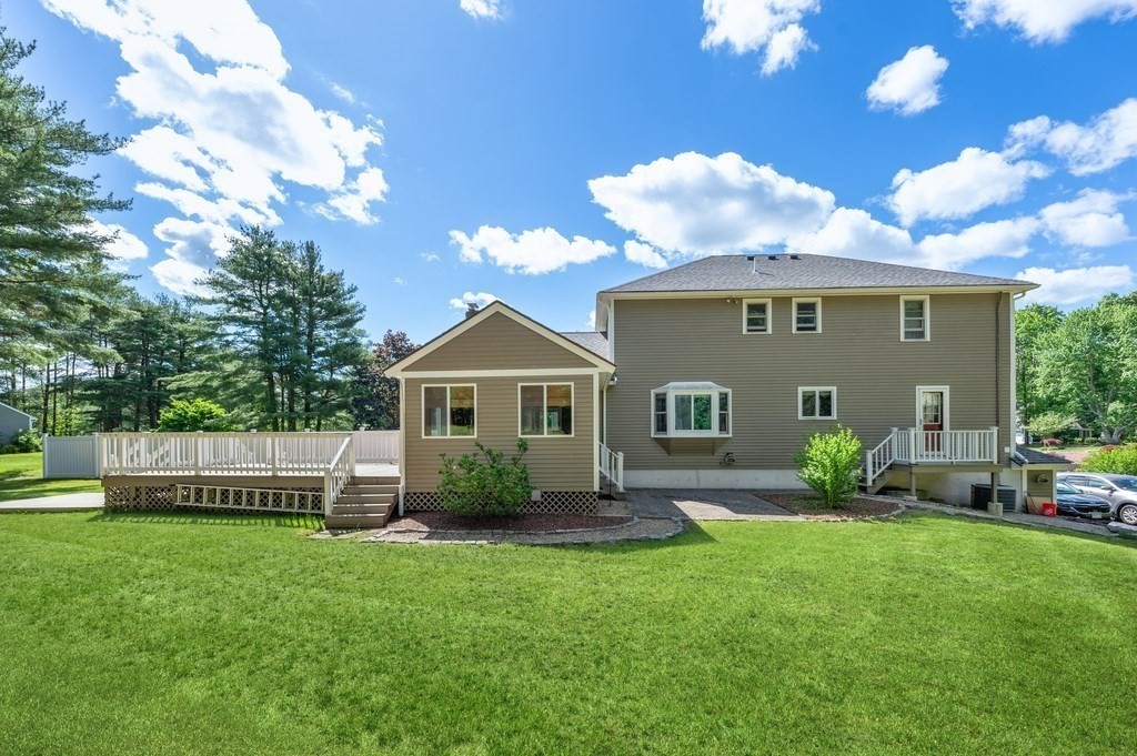 206 Olde Forge Road Hanover, MA 02339 - Photo 41 of 42 a front view of a house with a garden and yard