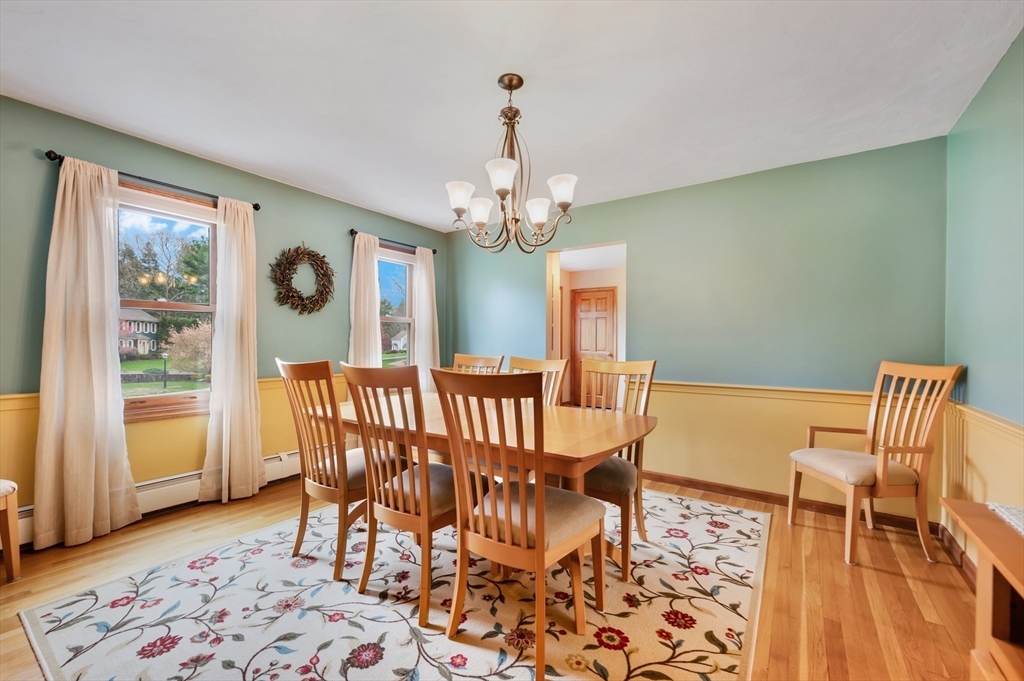 206 Olde Forge Road Hanover, MA 02339 - Photo 10 of 42 a view of a dining room with furniture window and wooden floor
