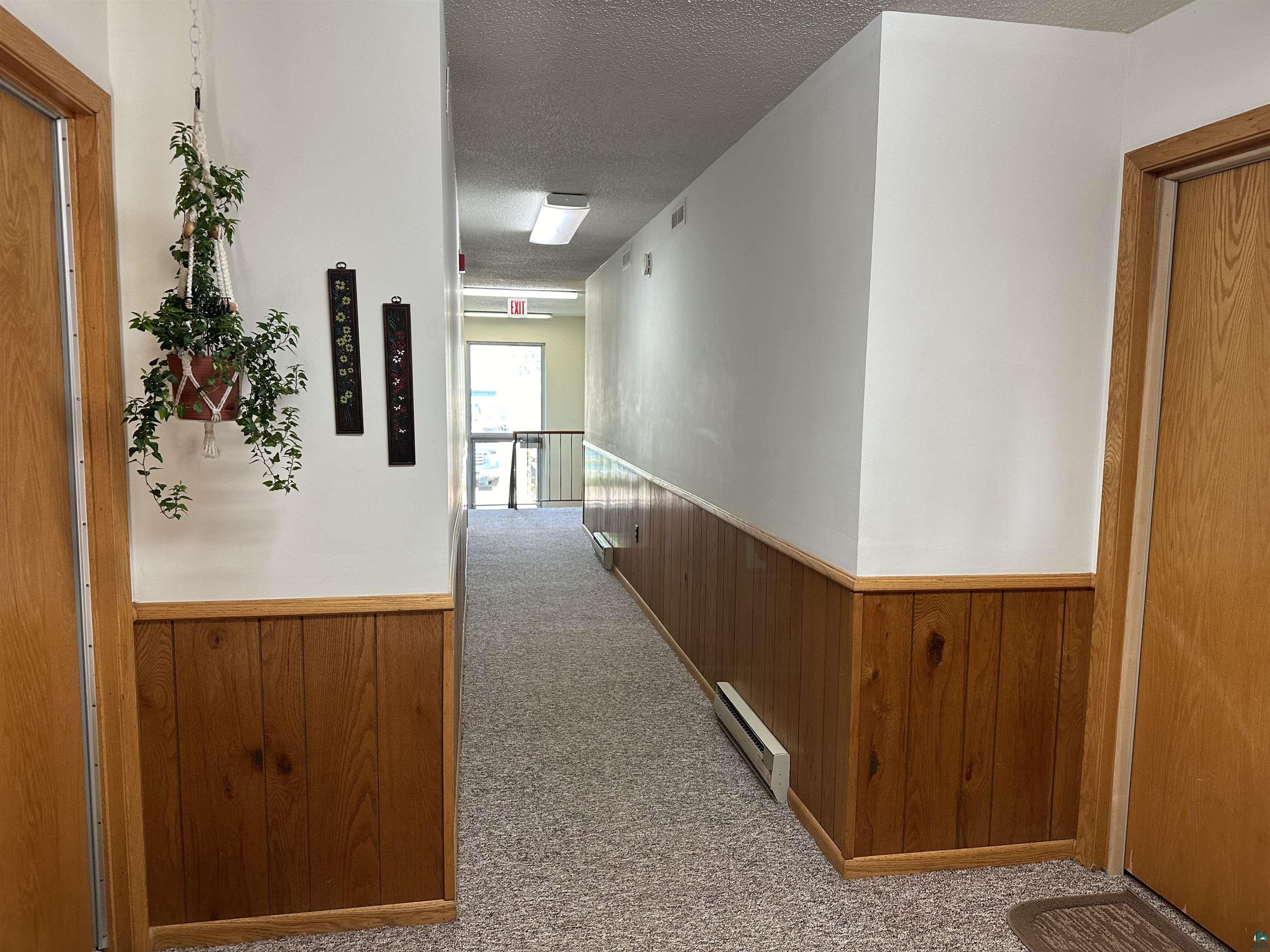 850 Spring Lake Road Cloquet, MN 55720 - Photo 11 of 18 Hall with light carpet and a textured ceiling