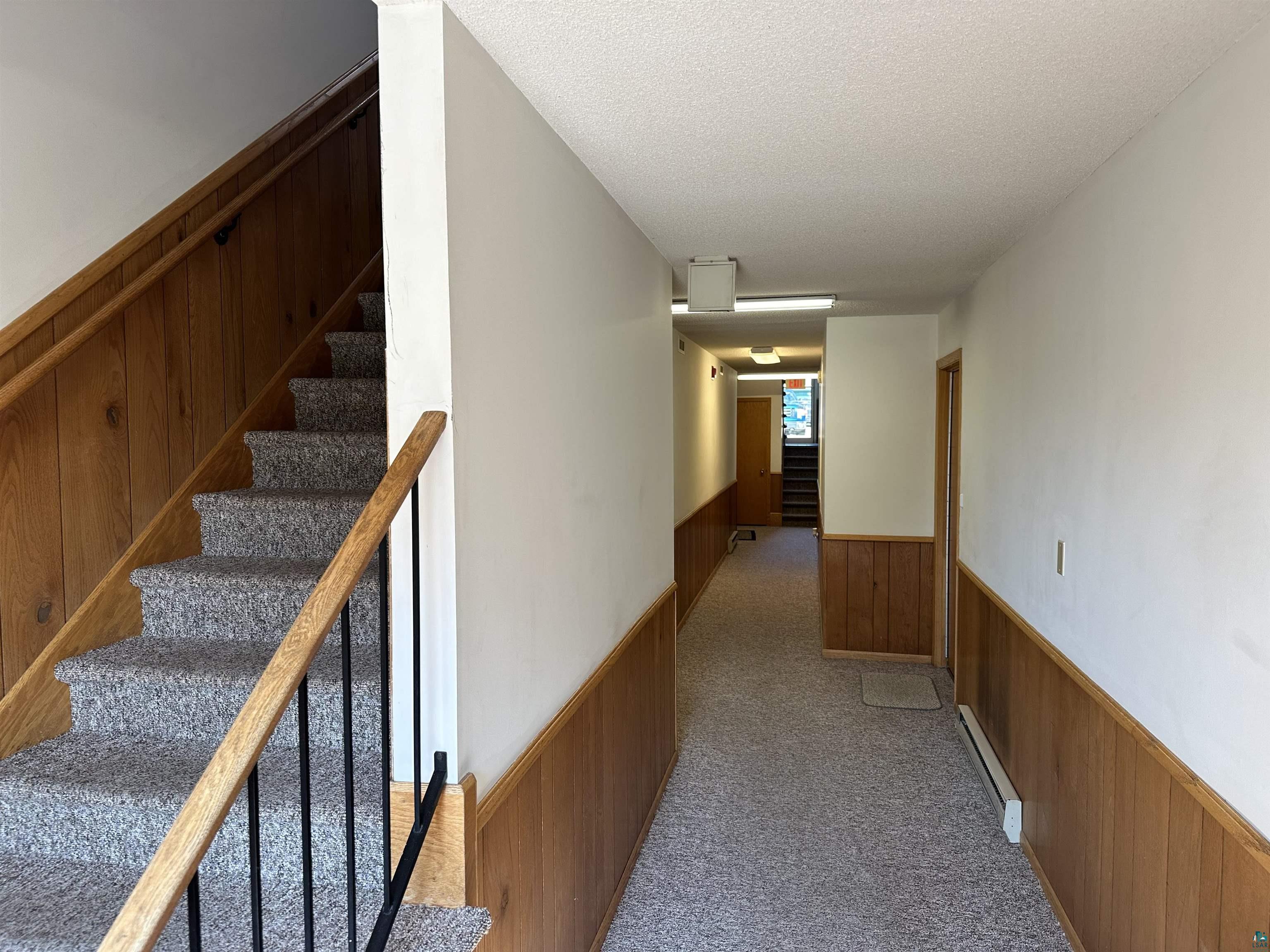 850 Spring Lake Road Cloquet, MN 55720 - Photo 9 of 18 Interior space with baseboard heating, carpet, and a textured ceiling