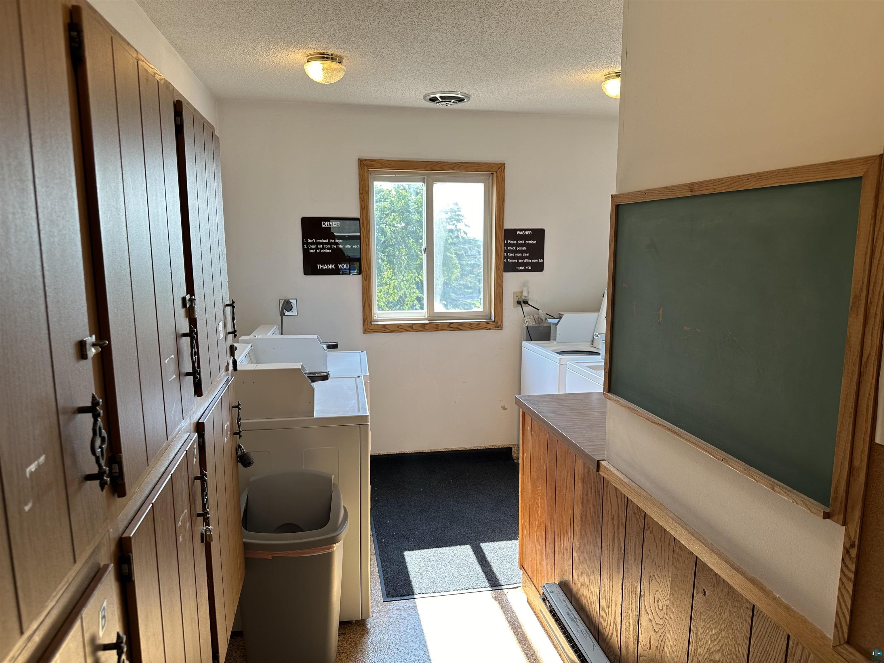 850 Spring Lake Road Cloquet, MN 55720 - Photo 10 of 18 Bathroom featuring washing machine and dryer and a textured ceiling