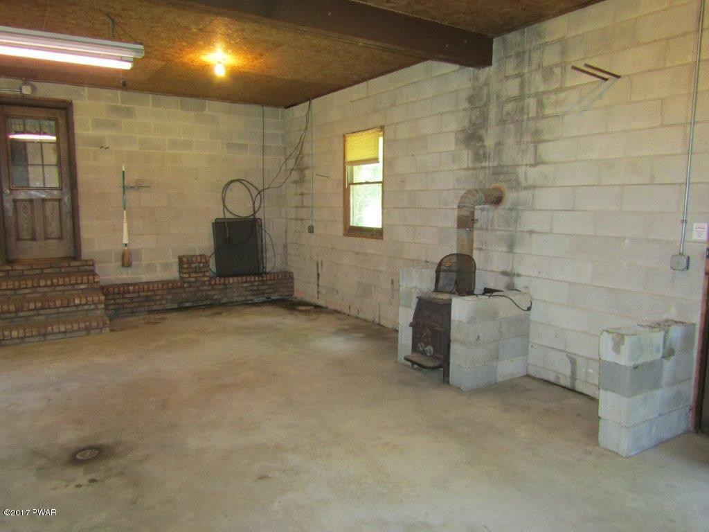 227 Hemlock Grove Road Newfoundland, PA 18445 - Photo 39 of 49 a bathroom with a tub a sink and a shower