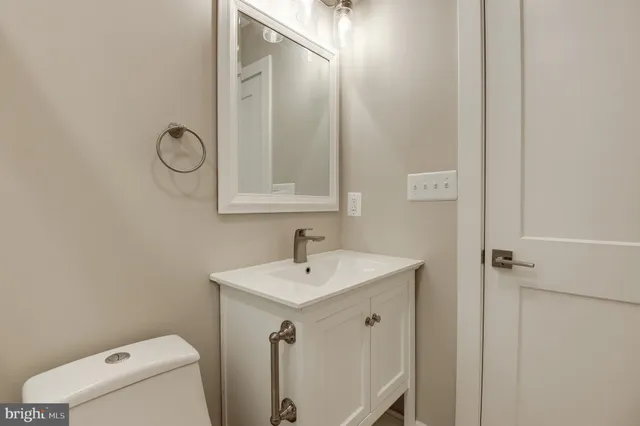 a view of room with stairs and wooden floor