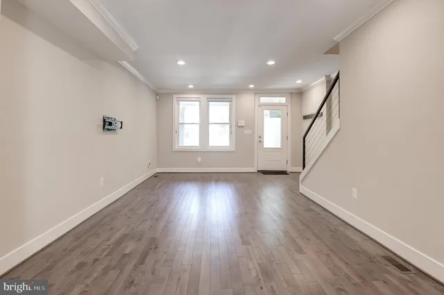 a kitchen with stainless steel appliances granite countertop a refrigerator a sink and a stove