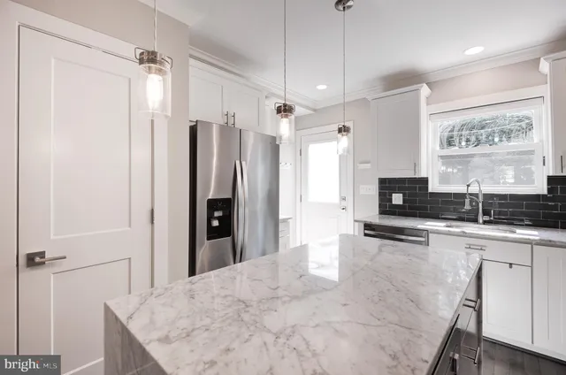 a view of balcony with wooden floor and outdoor seating