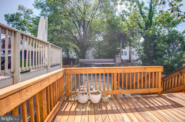 a kitchen with white cabinets stainless steel appliances and sink