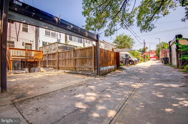 a kitchen with stainless steel appliances a refrigerator and a stove top oven