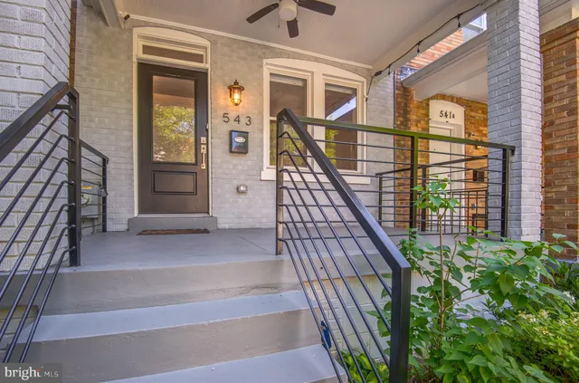 a bathroom with a sink mirror bathtub and toilet