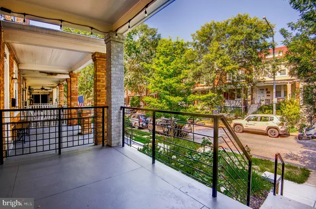 a bathroom with a shower a toilet and a tub