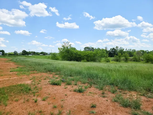 a view of a lake with a big yard