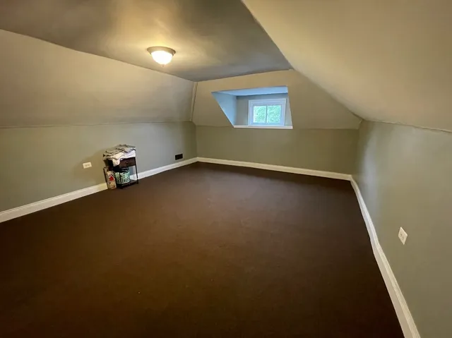 an empty room with a empty space and windows