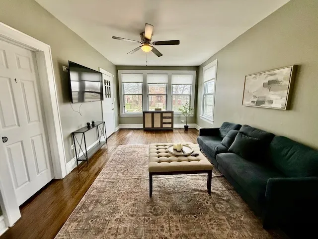 a living room with furniture and a large window