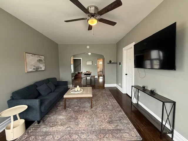 a living room with furniture and a flat screen tv
