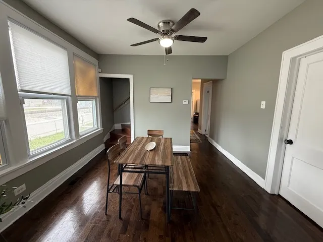a workspace with wooden floor and a window