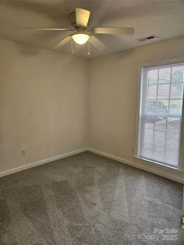 an empty room with a empty space and a window