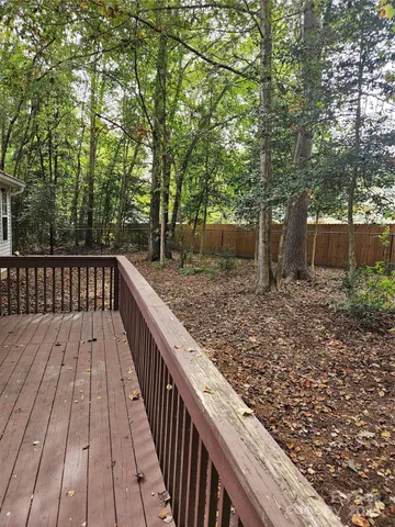 a view of wooden deck and a garden