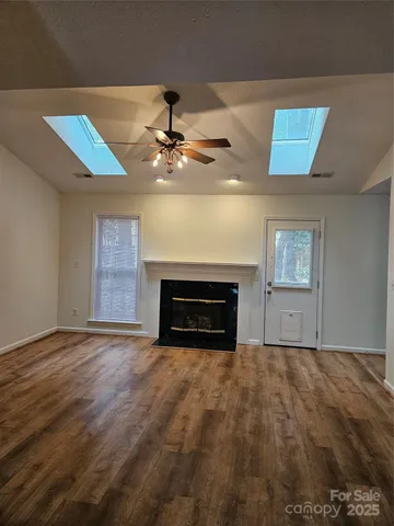 a view of an empty room with a fireplace