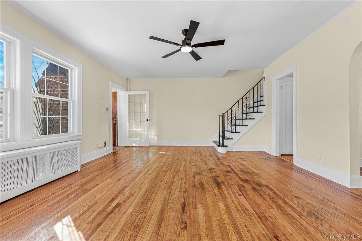 179-67 Selover Road Queens, NY 11434 - Photo 13 of 49 a view of empty room with wooden floor and ceiling fan