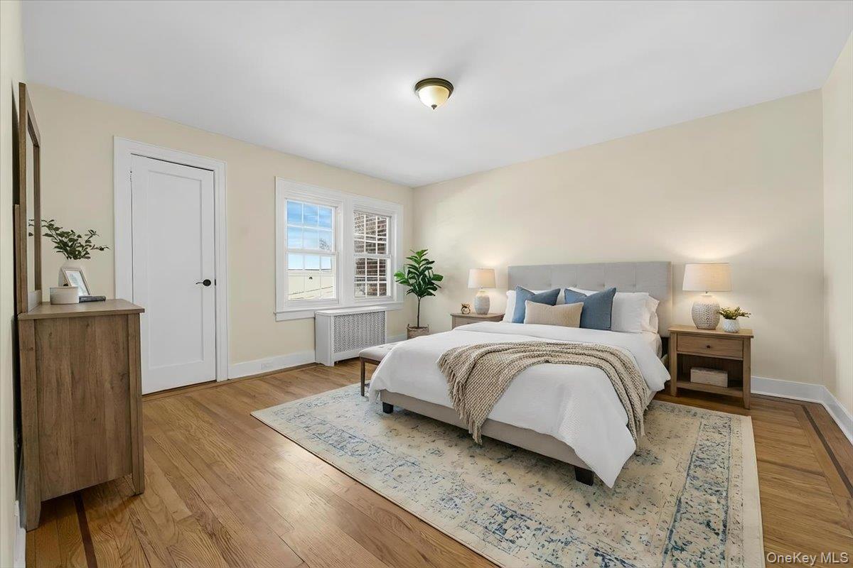 179-67 Selover Road Queens, NY 11434 - Photo 18 of 49 a bedroom with a bed and wooden floor