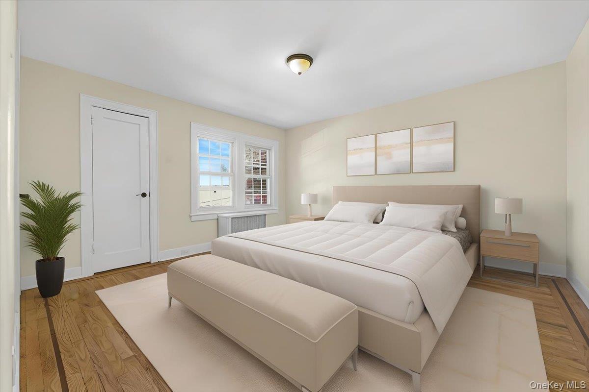 179-67 Selover Road Queens, NY 11434 - Photo 19 of 49 a bedroom with a large bed and a potted plant