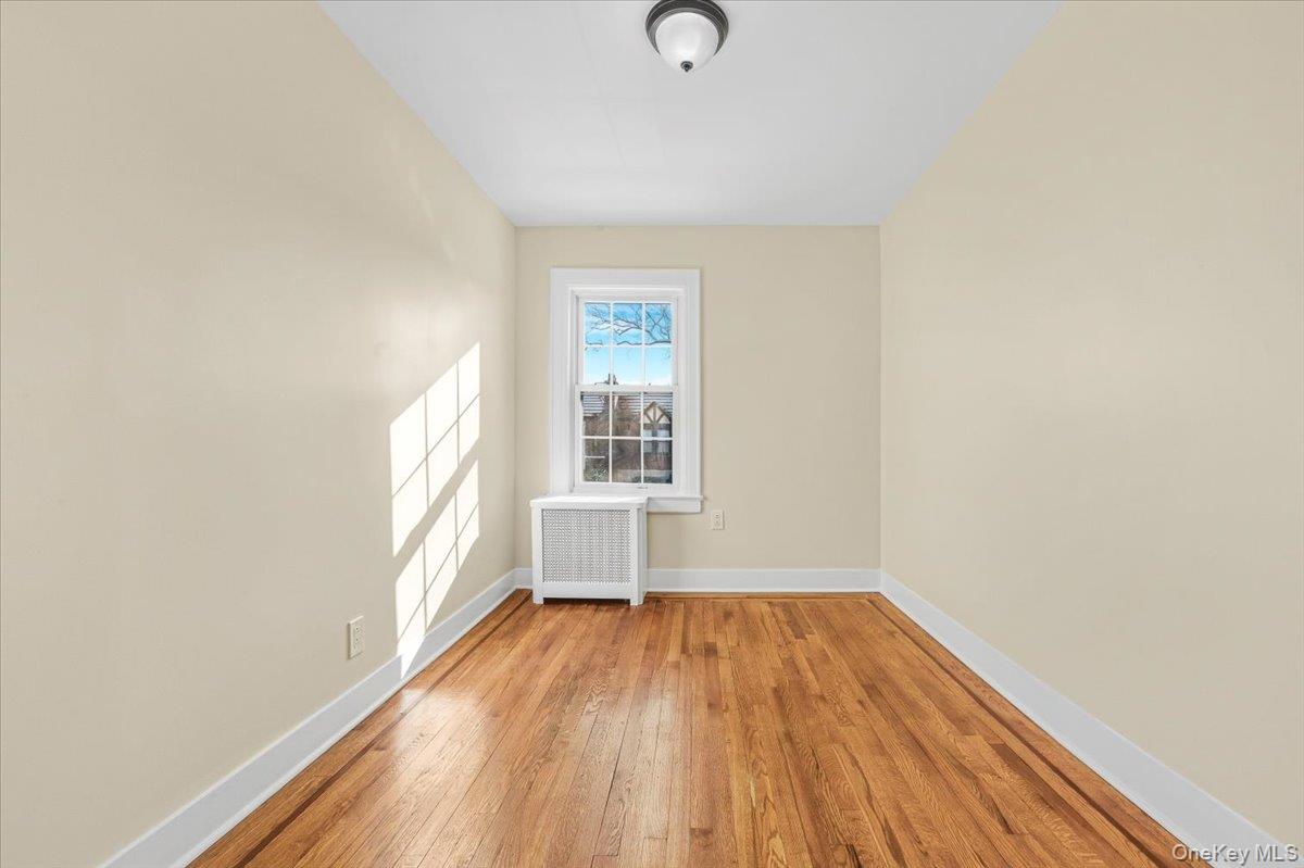 179-67 Selover Road Queens, NY 11434 - Photo 23 of 49 a view of empty room with wooden floor and fan