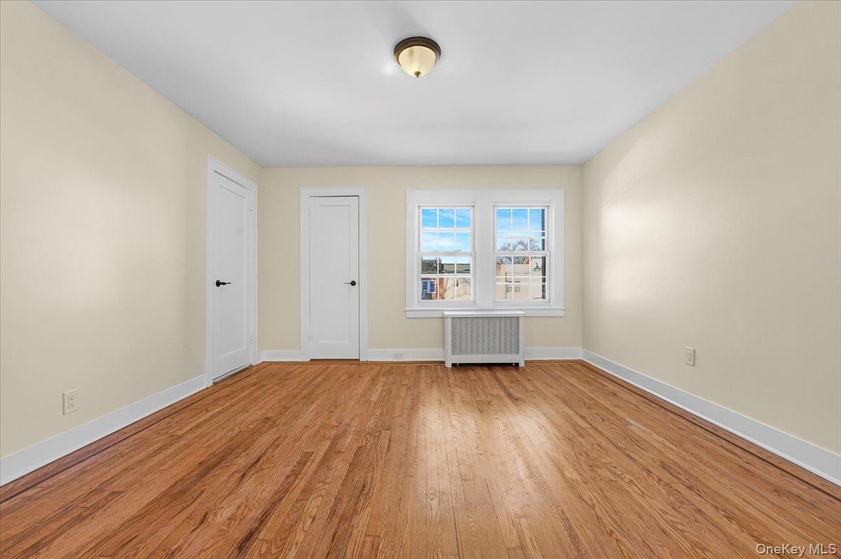 179-67 Selover Road Queens, NY 11434 - Photo 24 of 49 wooden floor in an empty room with a window