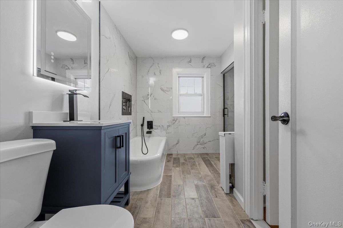 179-67 Selover Road Queens, NY 11434 - Photo 26 of 49 a white toilet sitting next to a bathroom sink