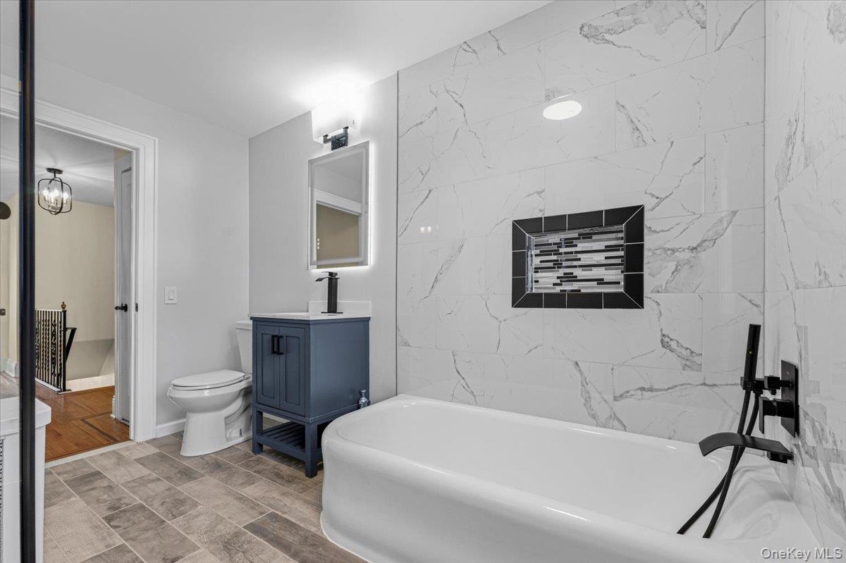 179-67 Selover Road Queens, NY 11434 - Photo 28 of 49 a bathroom with a toilet a sink and bathtub