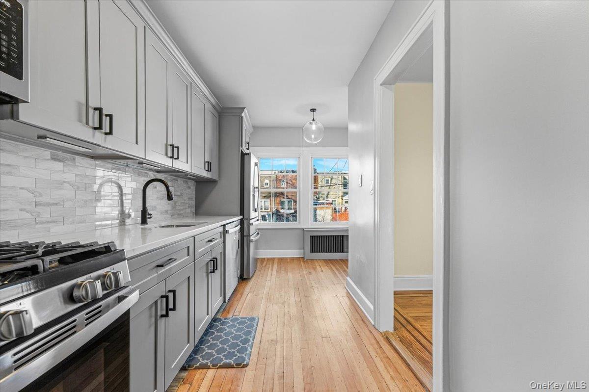179-67 Selover Road Queens, NY 11434 - Photo 31 of 49 a kitchen with stainless steel appliances a sink stove and cabinets