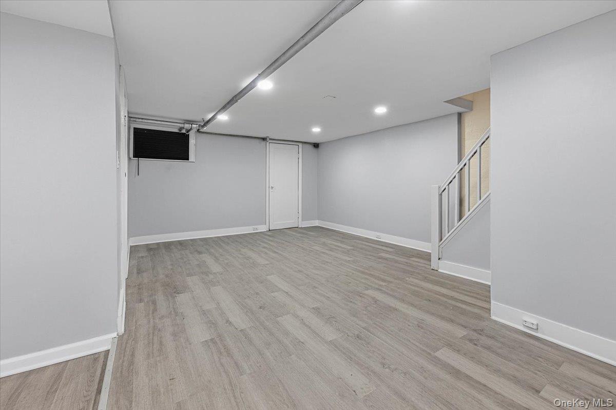 179-67 Selover Road Queens, NY 11434 - Photo 38 of 49 an empty room with wooden floor and windows